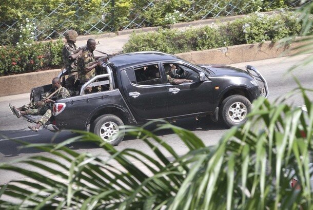Soldiers loyal to Laurent Gbagbo patrol a street in Abidjan