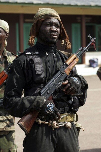 Forces loyal to Ivorian presidential claimant Alassane Ouattara stand guard in the provincial capital Yamoussoukro