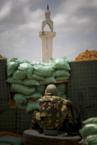 AMISOM soldier takes up forward position facing the minaret of mosque in northern Mogadishu